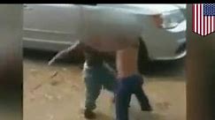 Fight video shows kids punching each other as adults take photos and laugh in Wilmington, Delaware