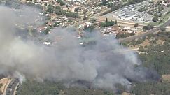 Bushfire south of Perth threatening homes and theme park