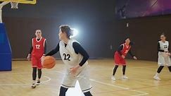 Training basketball game, female player successfully scores the ball in the basket, the confrontation of two team of basketball players, woman power, 4k slow motion.