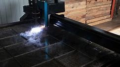 time lapse of plasma cutter. Plasma robotic industrial equipment works with metall sheet.