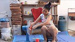 Beautifull Single Mom's Cleaning The Fan At Her House