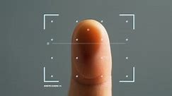 Futuristic biometric fingerprint security scan of a human finger.