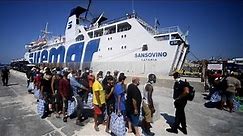 Hundreds of migrants arrive on Italian island of Lampedusa