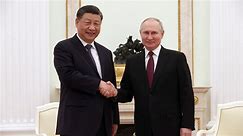 China's Xi meets with Putin, sends warning to West
