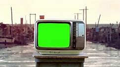 Old TV With Green Screen on the Street in A Ghost Town. Close Up.