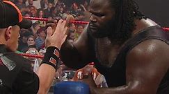 John Cena battles Mark Henry in an arm wrestling contest