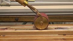 Using The Heated Gilding Roller - Applying Real Gold Foil to the Edge of a Book.