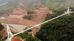 New glass bridge in Vietnam suspends visitors between two mountains
