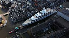 See superyacht squeeze through narrow canals