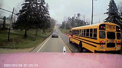 See a near collison between a tractor-trailer and a school bus