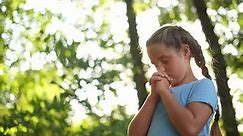 child pray. young gratitude a lifestyle god religion concept. little girl in nature outdoors praying dreams of happiness to god. praise worship freedom concept. kid praying in the forest