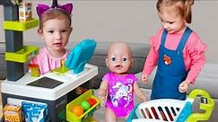 Funny baby Pretend Play Supermarket and doing Shopping with Baby Born Doll