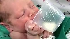 Funny Babies - Infants drink milk from a cup