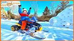 Driving Power Wheel snowmobile, awesome winter sledding track and snow igloo. Educational | Kid Crew