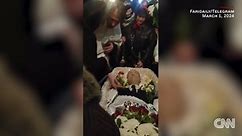 Video shows Navalny's mother at her son's casket during funeral