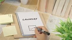 TICKING OFF LAUNDRY WORK FROM CHECKLIST