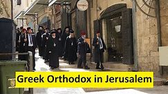 During Holy Week, the Eastern Orthodox procession enters the Church of the Resurrection in Jerusalem