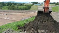 Excavator digging a hole ( multi - angle)