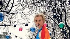 Brave Model Anastasia Harris in the Snow with a Dress & High Heels & a Rainbow Flag