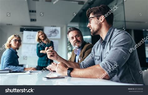 young designer giving   ideas stock photo edit