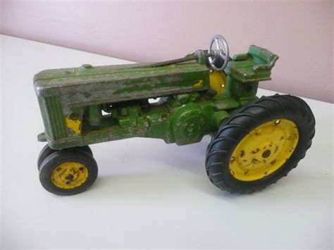 original vintage 1950 s john deere toy tractor with metal rims see
