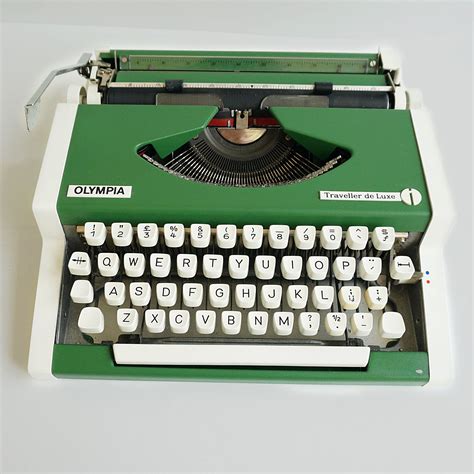olympia traveller deluxe typewriter  cup  retro typewriters