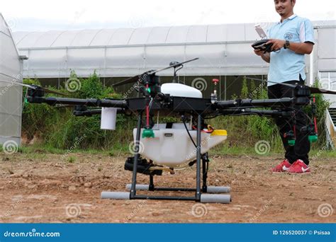 agriculture drone  spraying liquid fertilizer  herbicide  editorial image cartoondealer