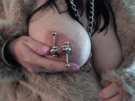 female stretched nipple piercing