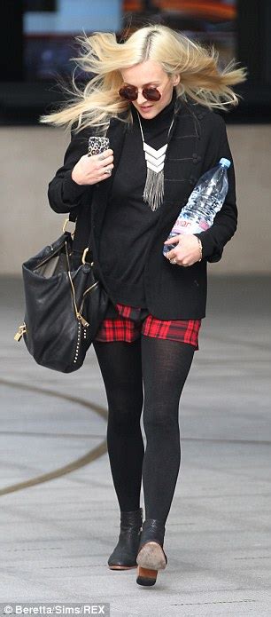 fearne cotton has her hands full as the windy weather play havoc with