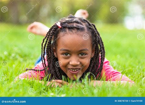 Outdoor Portrait Of A Cute Young Black Girl Smiling African Pe Stock