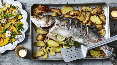Whole Baked Sea Bass On Potatoes Recipe Bbc Food