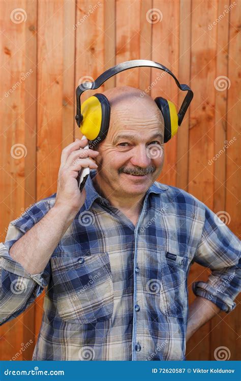 construction worker  protective headphones   break talk stock image image  older
