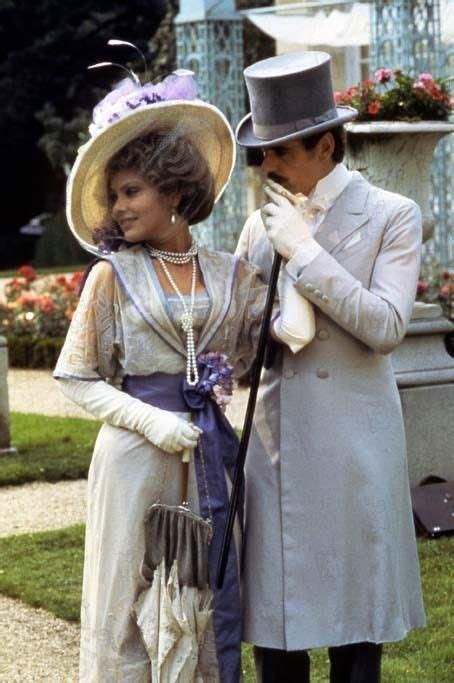 ornella muti wearing white opera gloves with jeremy irons in dove gray from a still from their