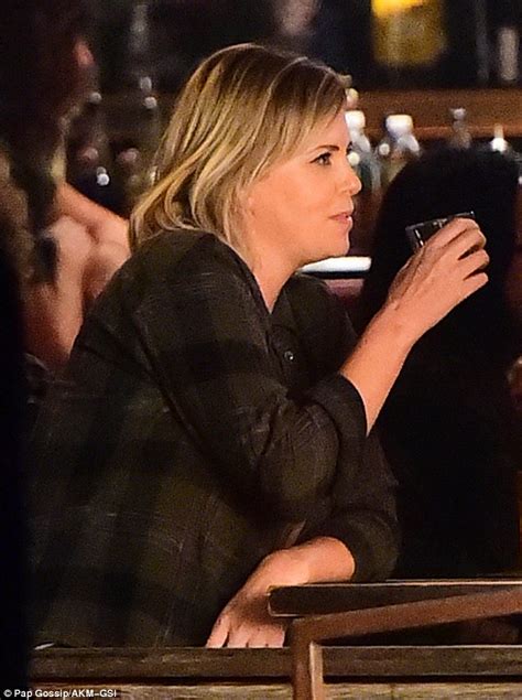 Charlize Theron Cuts A Laidback Figure At A Bar Filming Scenes For