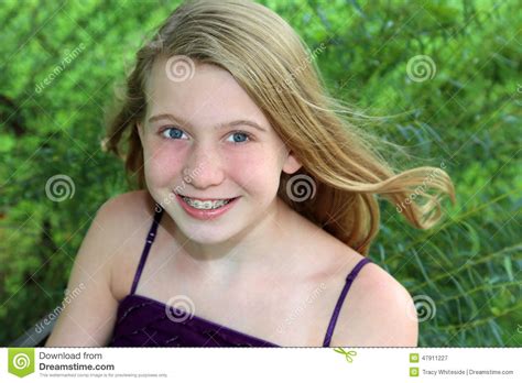 Smiling Blonde Girl In Grass Stock Image Image 47911227