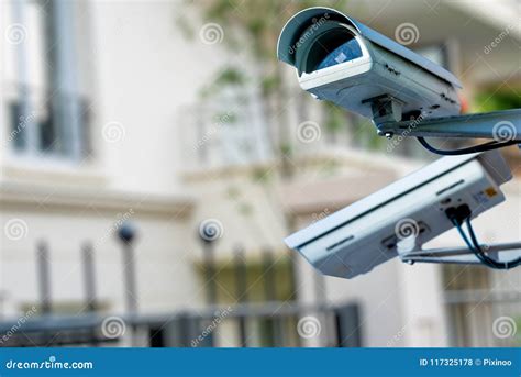 security cctv camera  surveillance system  private builiding  blurry background stock