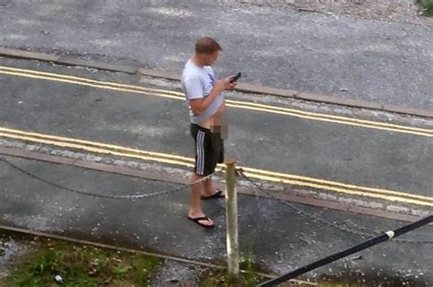 Bloke Caught Having A Hands Free Wee On Street – While Using His Phone