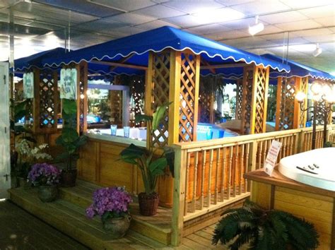 hot tub sitting  top   wooden deck    jacuzzi