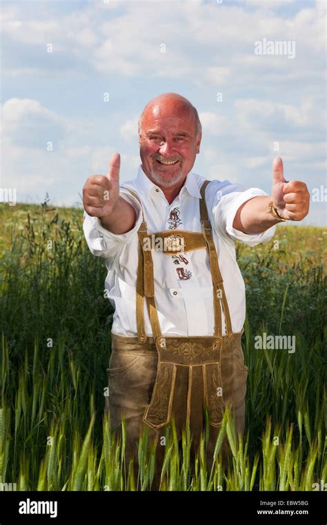 happy  man wearing traditional german costume  thumbs
