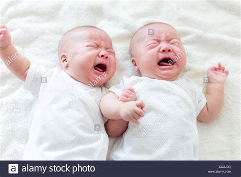 crying baby twins stock  crying baby twins stock images alamy
