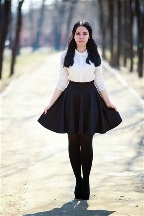 i love this minimalist look black skater skirt white blouse black tights and black platforms