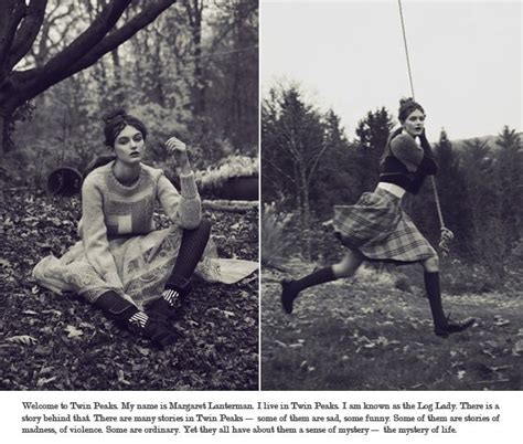 an old photo of two women in the woods one swinging on a rope while