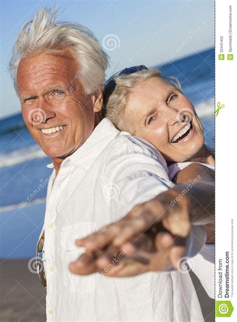 Happy Senior Old Couple On Tropical Beach Stock