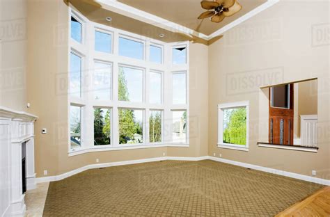 empty living room  large windows stock photo dissolve