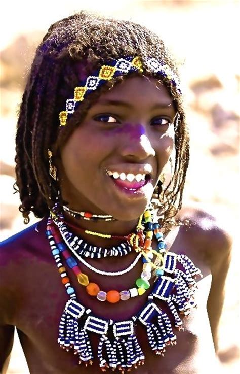 afar girl with sharpened teeth danakil ethiopia indian wedding outfits bridal jewelry