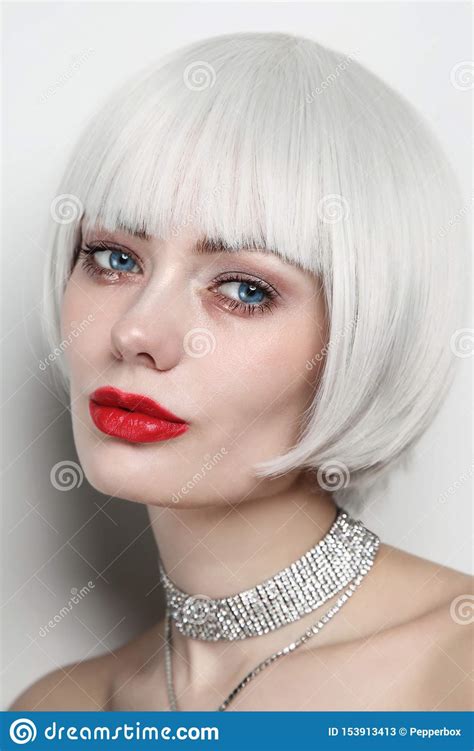 Vintage Style Portrait Of Beautiful Woman With Platinum Blonde Hair And
