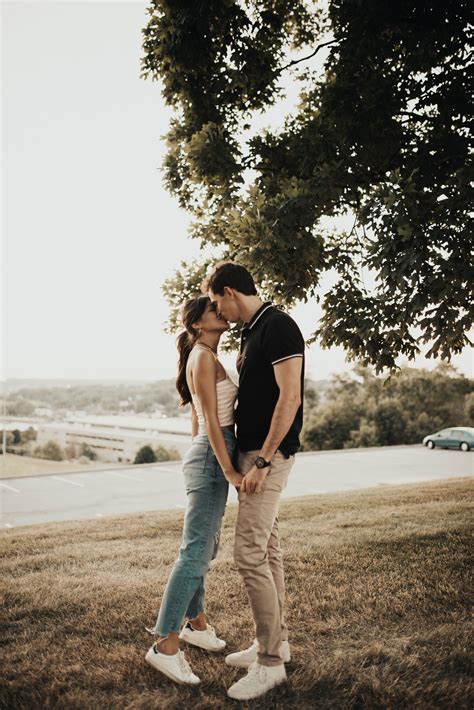 cute and warm couple session romantic engagement session in field