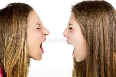 Two Angry Blond Girls Screaming At Each Other Isolated Stock Image