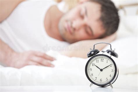 Man Sleeping With Alarm Clock Stock Images Image 24273214