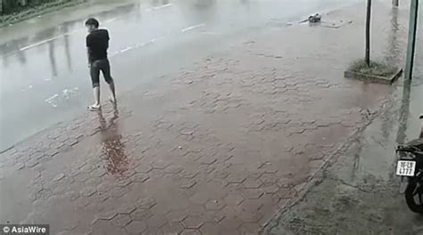 man who tries to pee in a puddle gets soaked by lorry